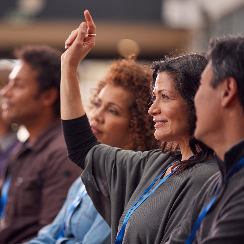 woman raising her hand